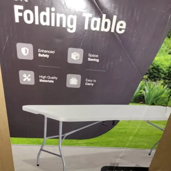 A new still boxed slight seconds 6ft Folding table..