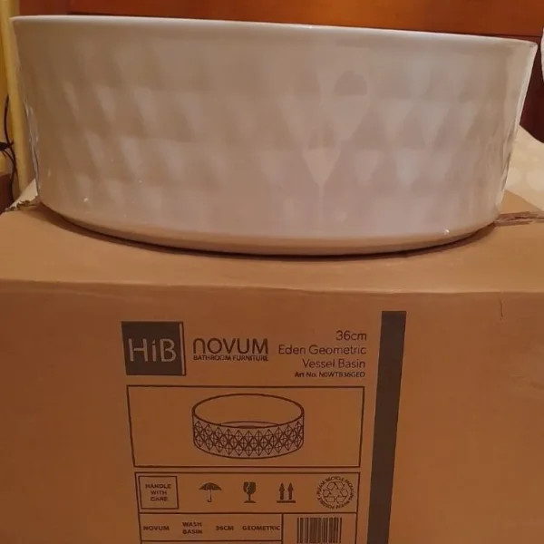 Eden Geometric wash hand basin with bath mat and shower hose