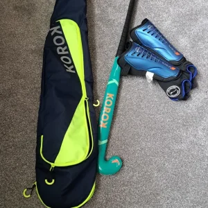 Hockey stick, bag and shin pads