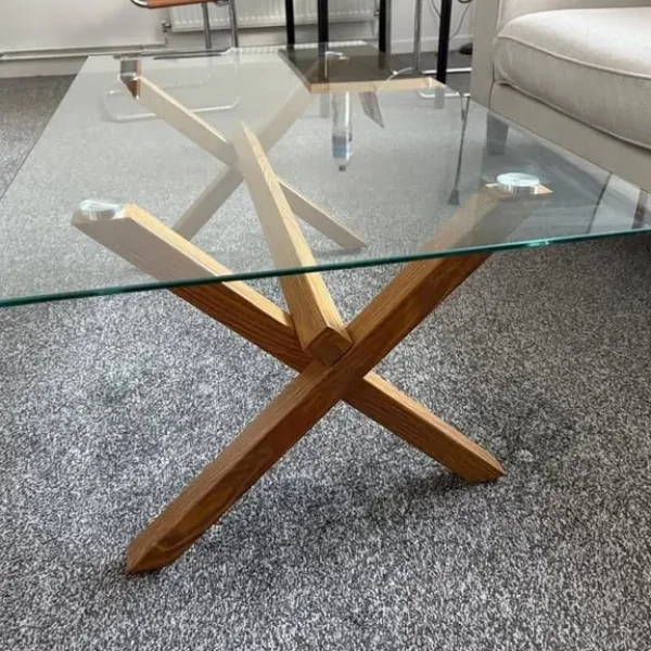 Tempered glass table with wooden-looking metal legs