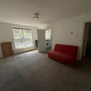 John Lewis red sofa bed with wheels