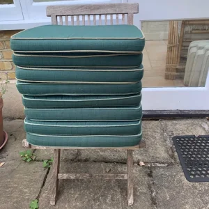 8 forest green piped foam garden cushions