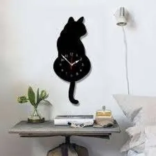 Cat-shaped wall clock with swinging tail