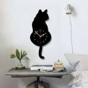 Cat-shaped wall clock with swinging tail