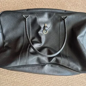 Estée Lauder black bag with handles