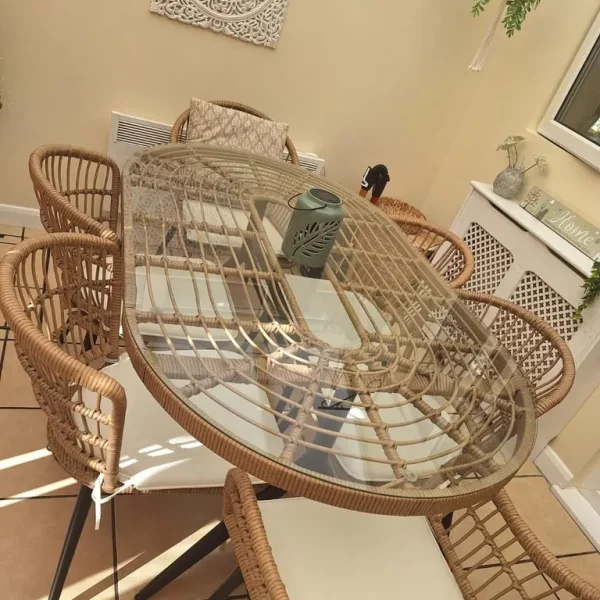 Glass topped oval dining table with 6 chairs