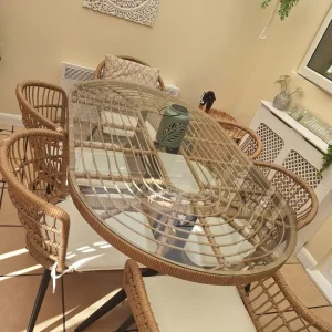 Glass topped oval dining table with 6 chairs