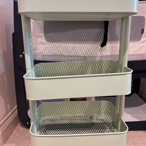 Green Ikea metal trolley on wheels
