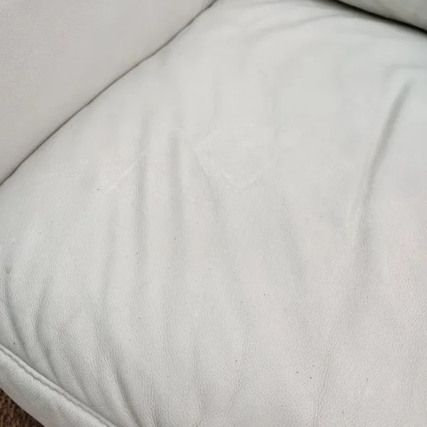 Comfy white real leather armchair and footstool