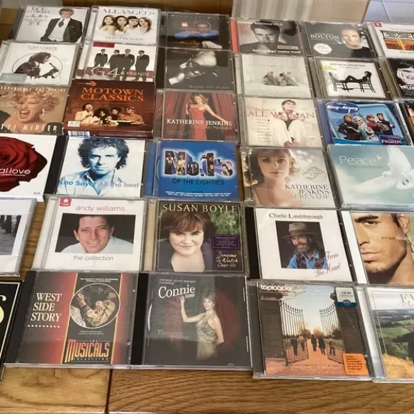 Bundle of CDs, DVDs, and a case