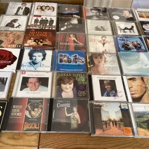 Bundle of CDs, DVDs, and a case