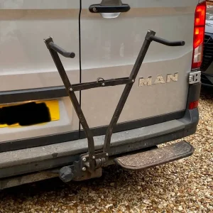 Cycle carrier-tow bar fitting.