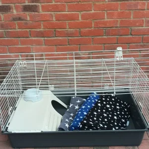 Guinea pig cage with custom made fleece liners