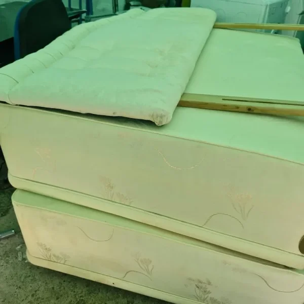 Double divan bed base with cream headboard
