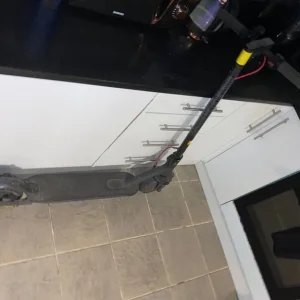 Electric scooter with charger - Image 3