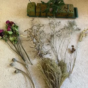Flower arranging tray with corkscrew hazel and dried flowers