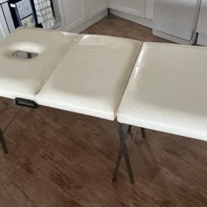 White collapsible massage table