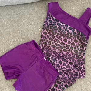 Girls gymnastics leotard and matching shorts. Aged 7-8
