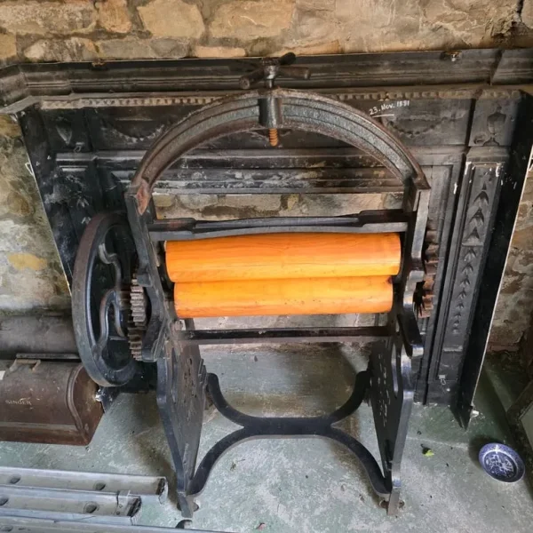 Antique mangle with cast iron and wooden rollers