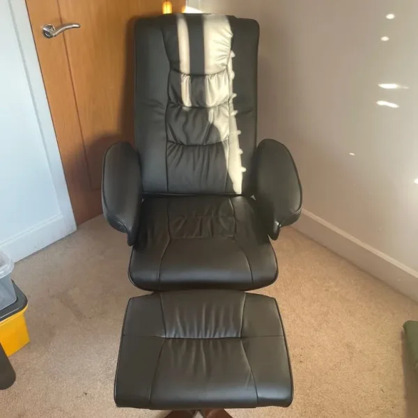 Black leather reclining chair and foot stool