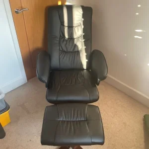 Black leather reclining chair and foot stool