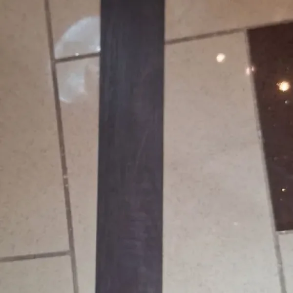 Dark brown textured flooring