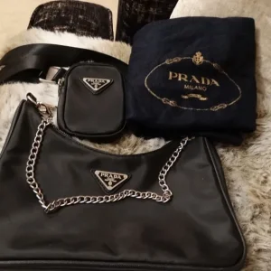 black nylon shoulder bag with purse and dust bag excellent condition