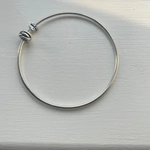 Bangle with T charm