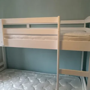 Children's bunk bed with pull-out bottom bed