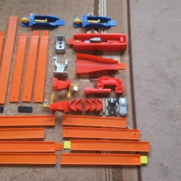 Hot Wheels track bundle with accessories and two cars
