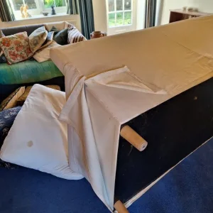 Cream sofa with blue throw blanket - Image 6