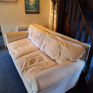 Cream sofa with blue throw blanket - Image 7