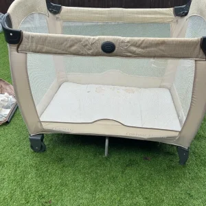 Graco travel cot with mesh sides and sturdy build