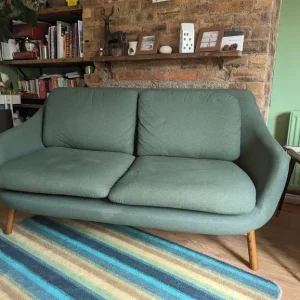 Oslo 2 seater sofa, woodland green with dark stained legs
