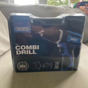 New boxed combi drill with charger and battery