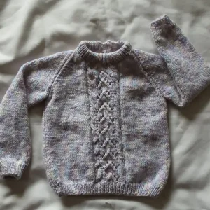 Handknitted multicoloured jumper for a tiny girl