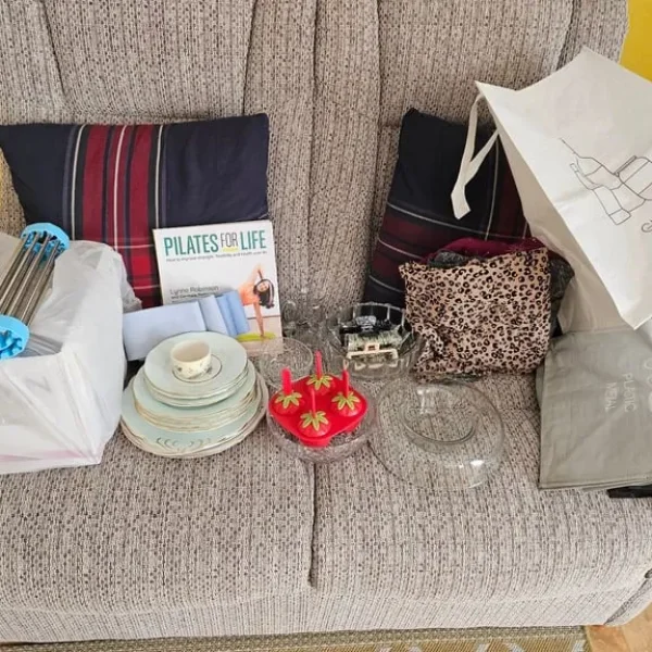 Champagne flute glasses, fruit bowls, old china plates and a Pilates book