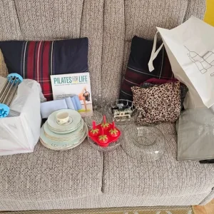 Champagne flute glasses, fruit bowls, old china plates and a Pilates book