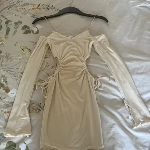 Oh polly Ruched Cut Out Sides Long Sleeves Ivory Mini Dress