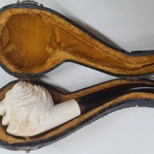 A vintage lion's head meerschaum pipe in original case