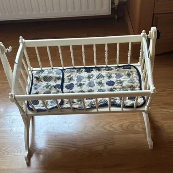 Dolls swinging cradle