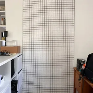 Two black metal grid wall panels