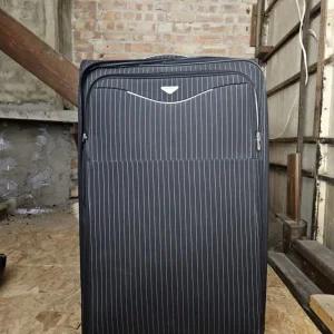 Large soft-sided suitcase with pinstripe pattern