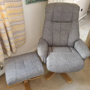 Swivel chair with footstool