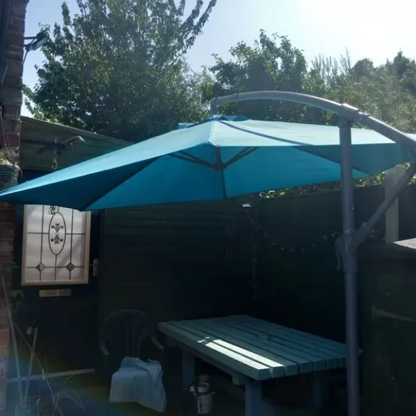 Large cantilevered parasol and weights