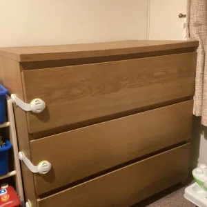 Malm chest of drawers with child safety locks