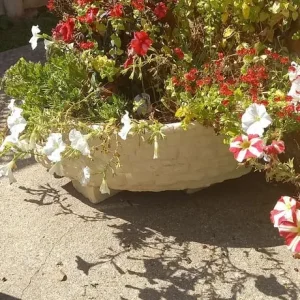 Assortment of concrete garden ornaments