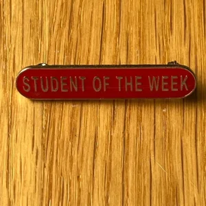 Student of the week red enamel badge