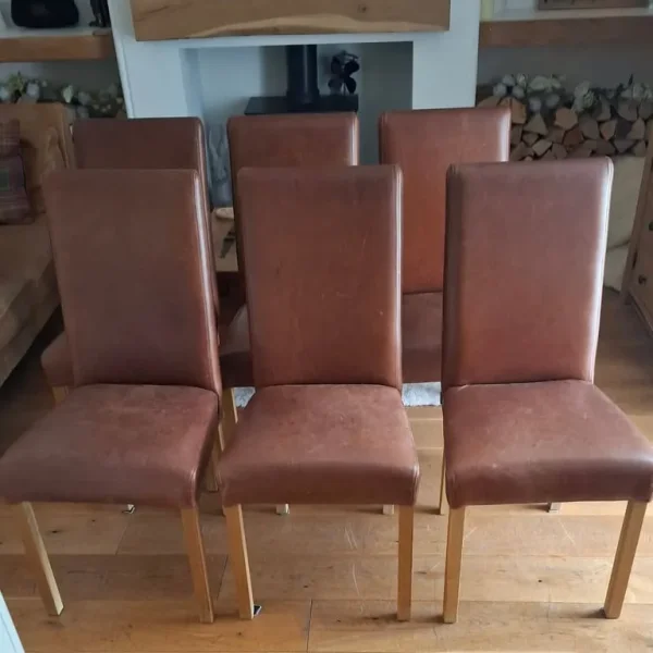 Indigo dining table and six oak leather chairs