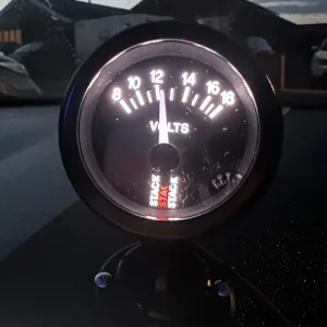 Stack Battery Voltmeter Gauge (Black Dial Face) - 52mm Diameter, LED Backlight